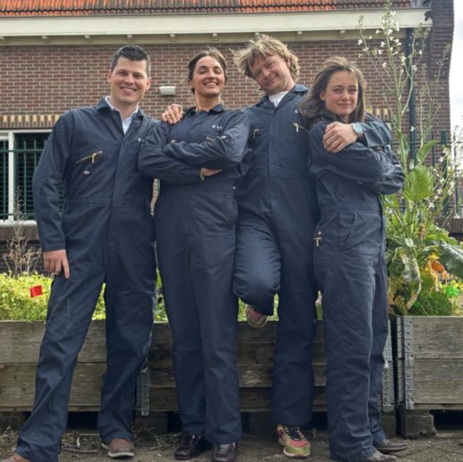 The Customer Experience team standing outside in Collie work overalls